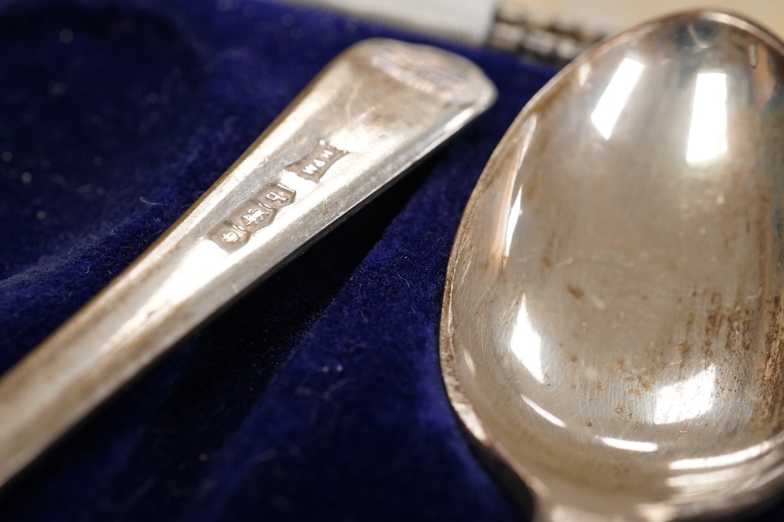 A collection of assorted silver to include five napkin rings including two pairs, a cased pair of glass butter dishes with silver butter knives, five golf related teaspoons, a cased set of six sterling cocktail sticks wi